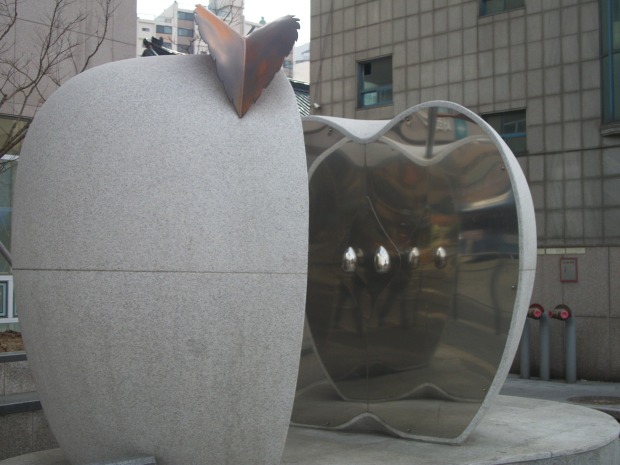 Found this apple statue on the side of a street in Seoul.  I'm not sure why the inside is reflective.